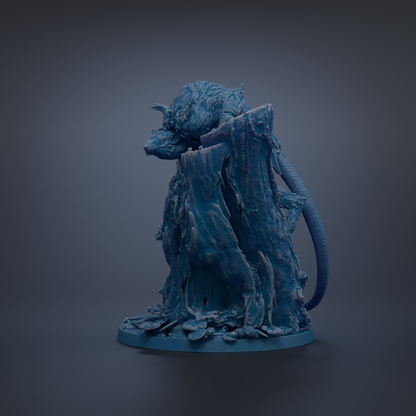A dark blue, sculpted figurine of a creature with a long, curved tail and sharp teeth, standing on a rock formation.