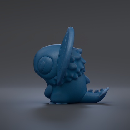 A blue, cartoon-like creature with a large head and small body is sitting on a gray surface.