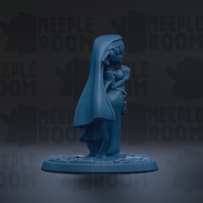 A blue figurine of a person with a long, flowing robe and a hood, standing on a base and facing away from the camera.