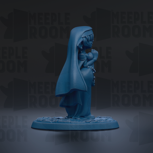 A blue figurine of a person with a long, flowing robe and a hood, standing on a base and facing away from the camera.
