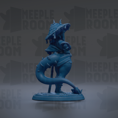 A blue figurine of a dragon-like creature with a pointed head and long tail, standing on a base.