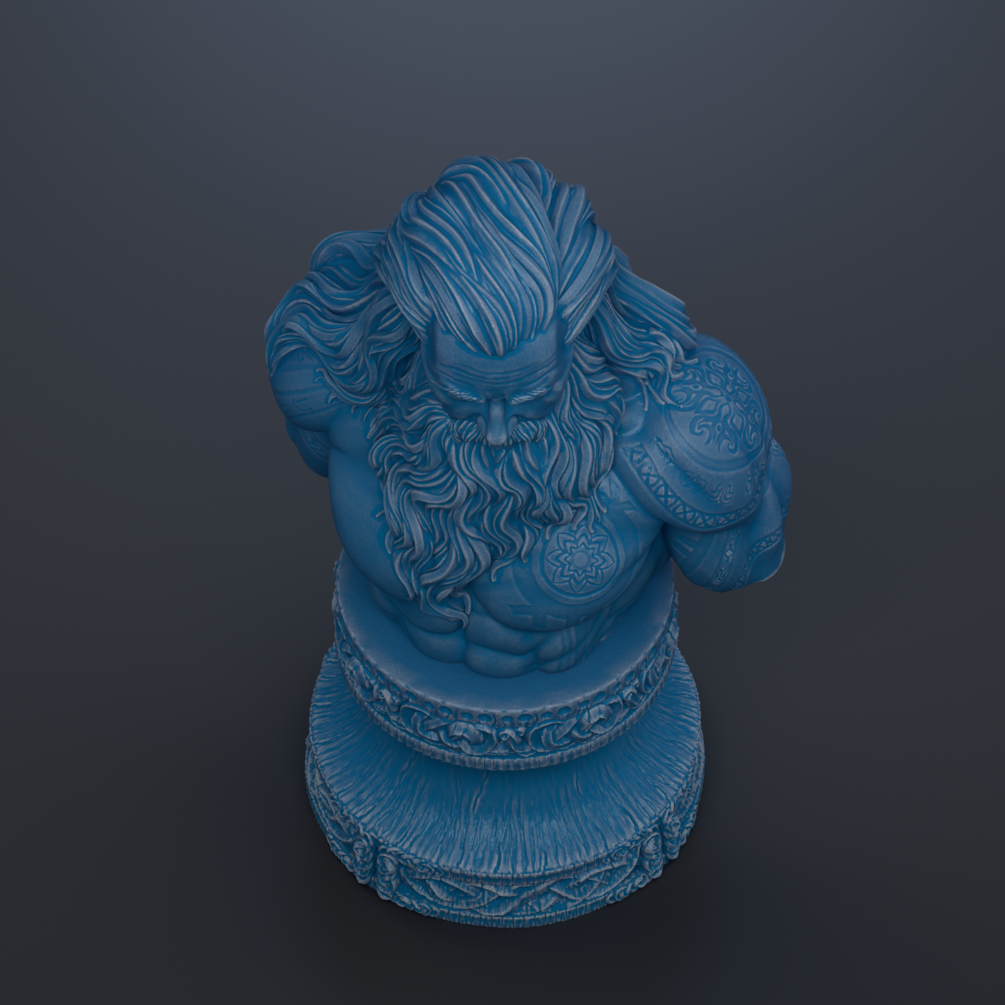 A blue statue of a bearded man with long hair, sitting on a decorative base.