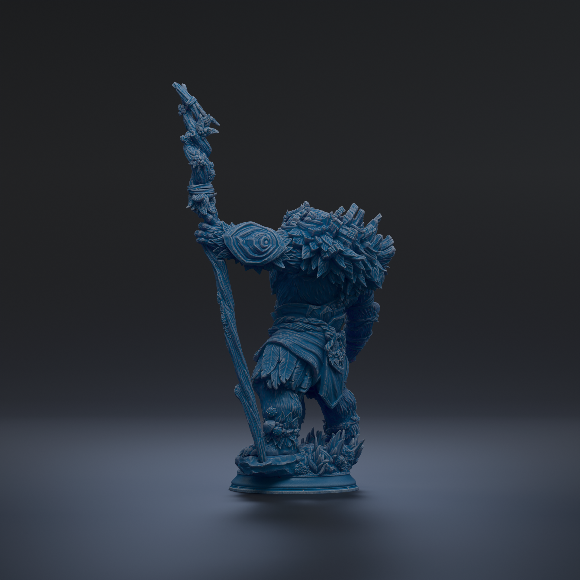 A blue figurine of a fantastical creature, possibly a dragon or serpent, standing on a pedestal against a dark background.