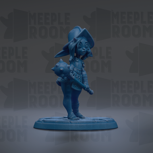 A blue figurine of a character with a pointed hat and a weapon, standing on a base.