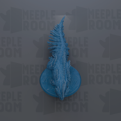 a blue, stylized dragon-like creature with a long, pointed tail, standing on a circular base.