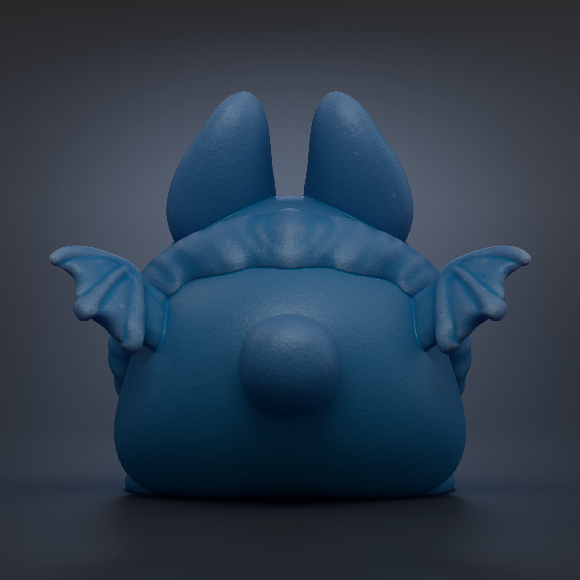 A blue, bat-like figurine with large ears and a round head is shown against a dark background.