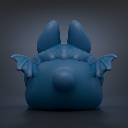 A blue, bat-like figurine with large ears and a round head is shown against a dark background.
