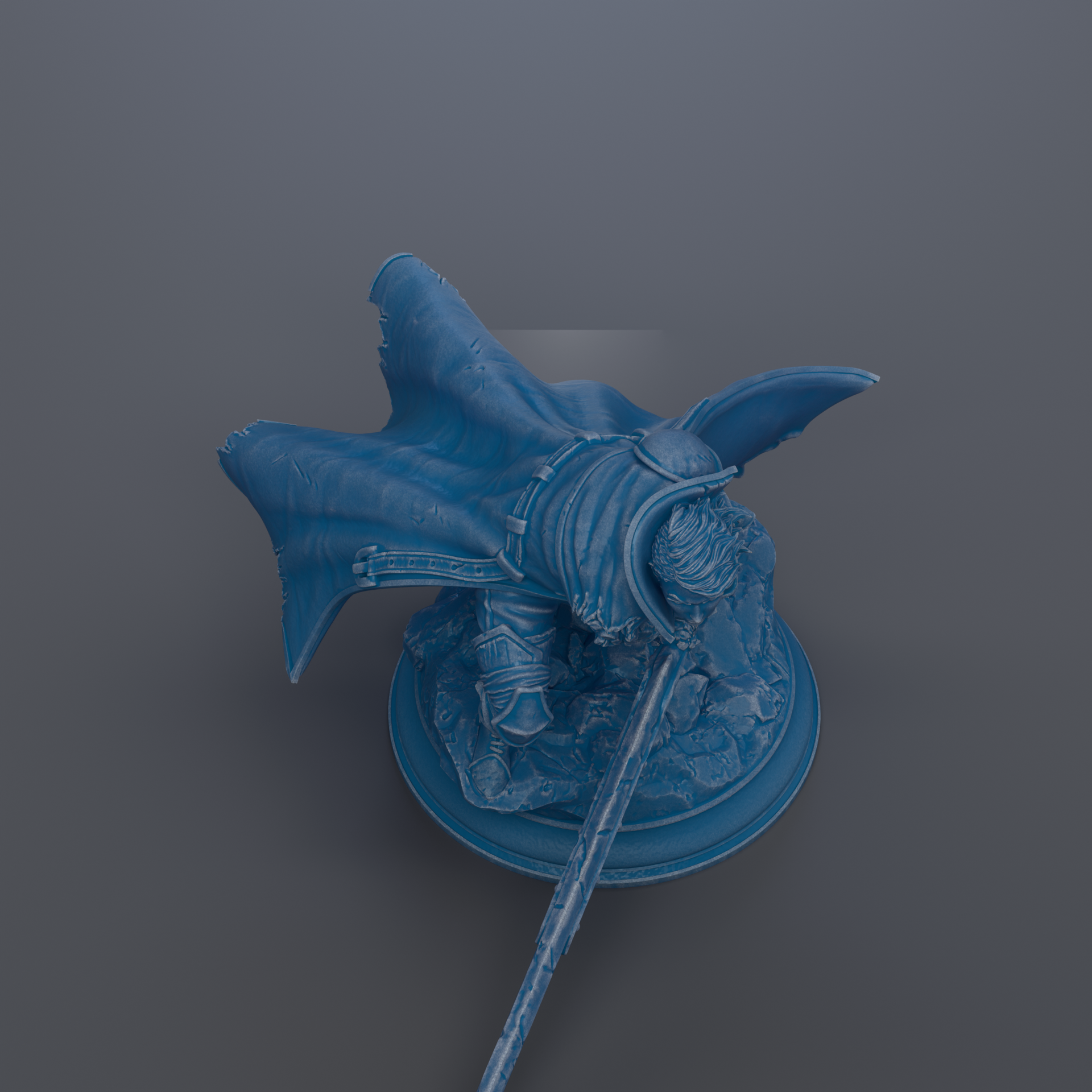 A blue statue of a winged figure with a pointed hat and sword, standing on a pedestal.