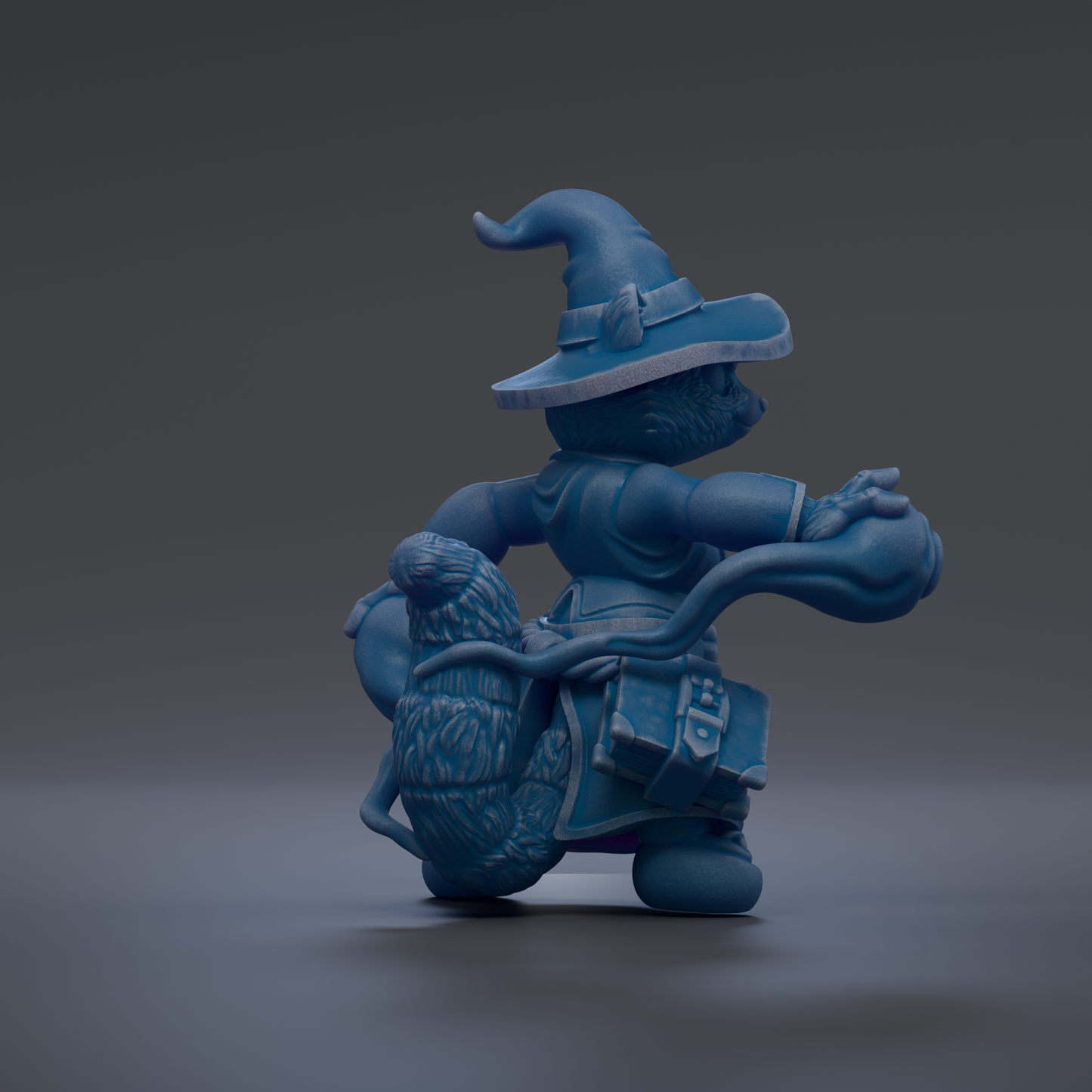 A blue, whimsical figurine of a character with a pointed hat and a large, detailed tail.