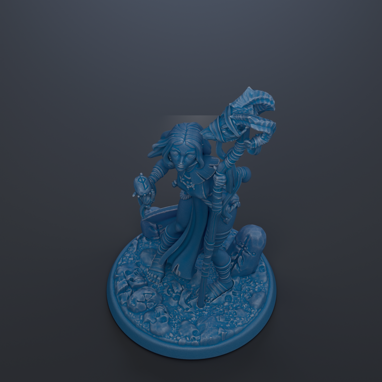 A blue figurine of a character with a snake-like creature on its back, standing on a base with a skull-like design.