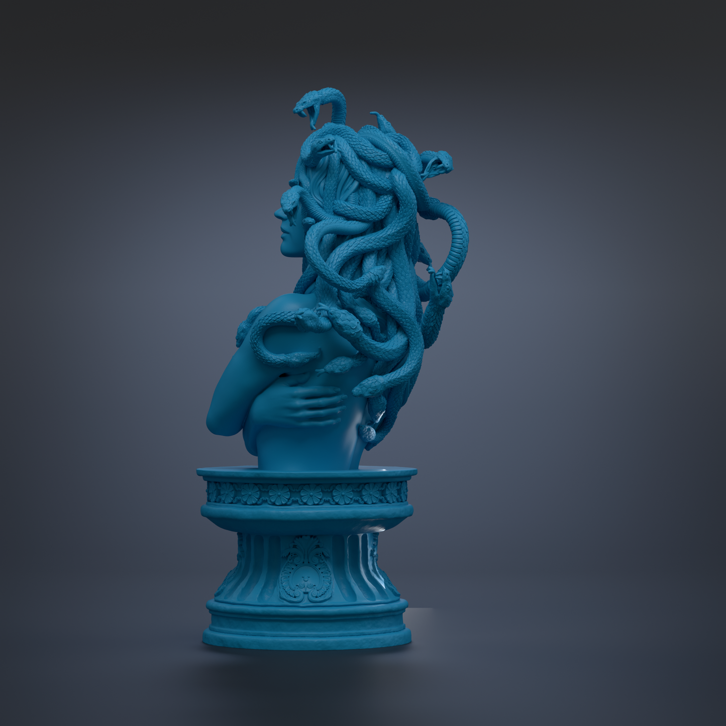 A blue bust sculpture of a woman with snakes wrapped around her head and neck, standing on a pedestal.