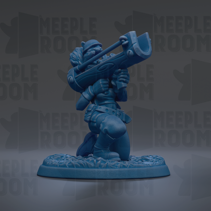 A blue figurine of a character holding a large object, possibly a tool or weapon, standing on a platform.