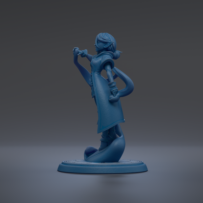 A blue figurine of a woman with a pensive expression, standing on a blue base.