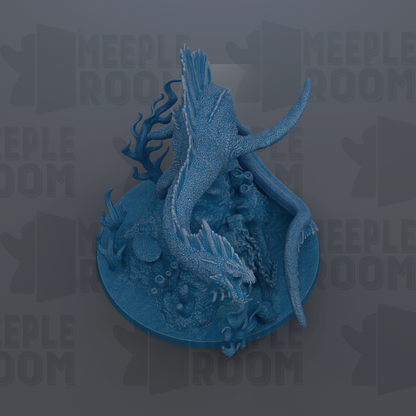 A blue, 3D-rendered dragon figurine is displayed on a circular base, surrounded by various aquatic elements such as plants and rocks.