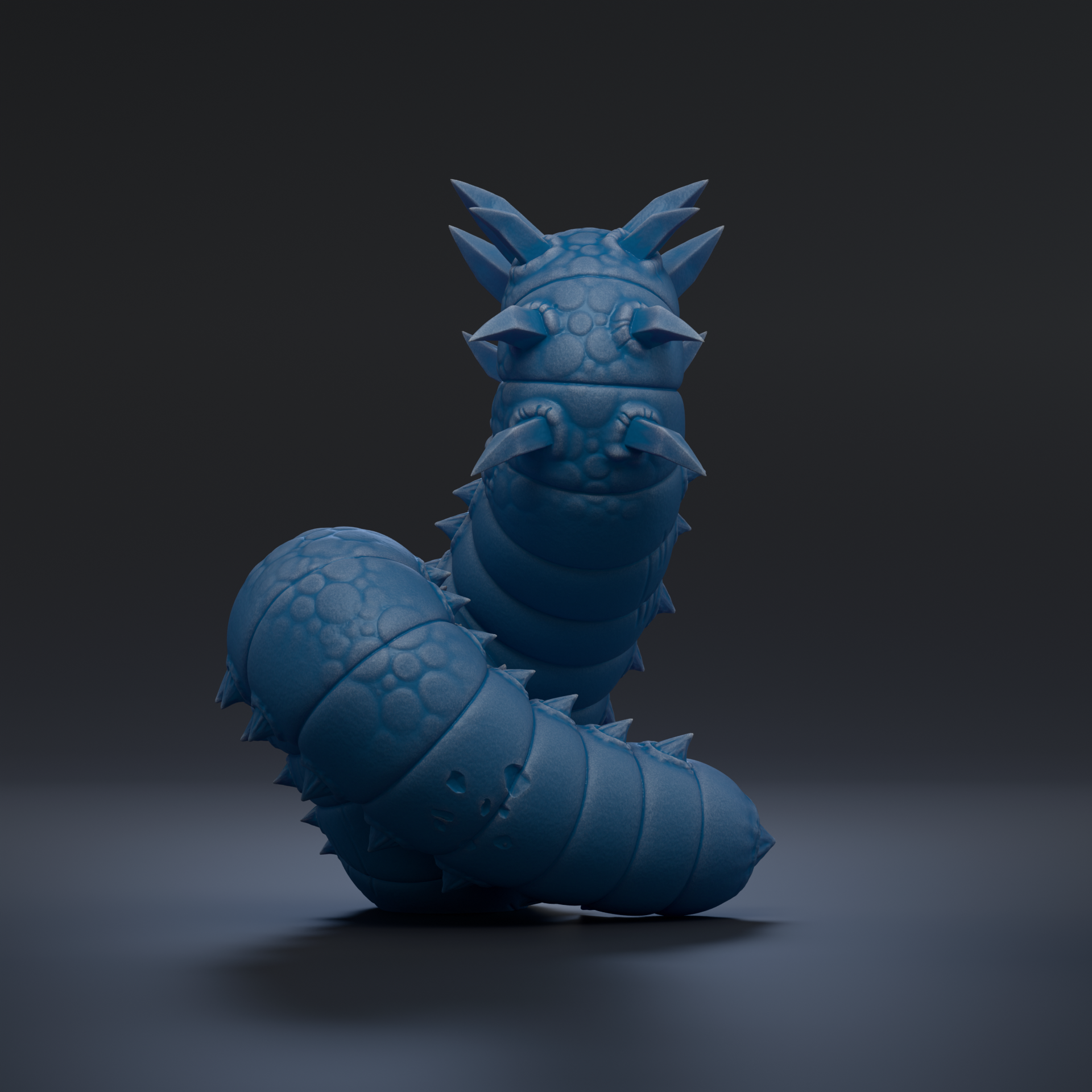 A 3D rendering of a blue, elongated creature resembling a snake or worm, with sharp teeth and spikes protruding from its head.