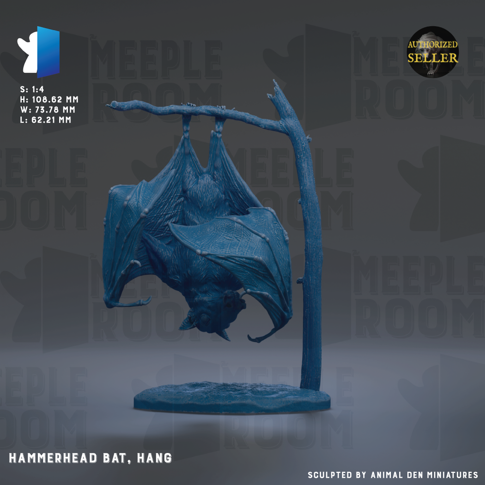 A blue hammerhead bat is hanging upside down from a branch, displayed on a circular base.