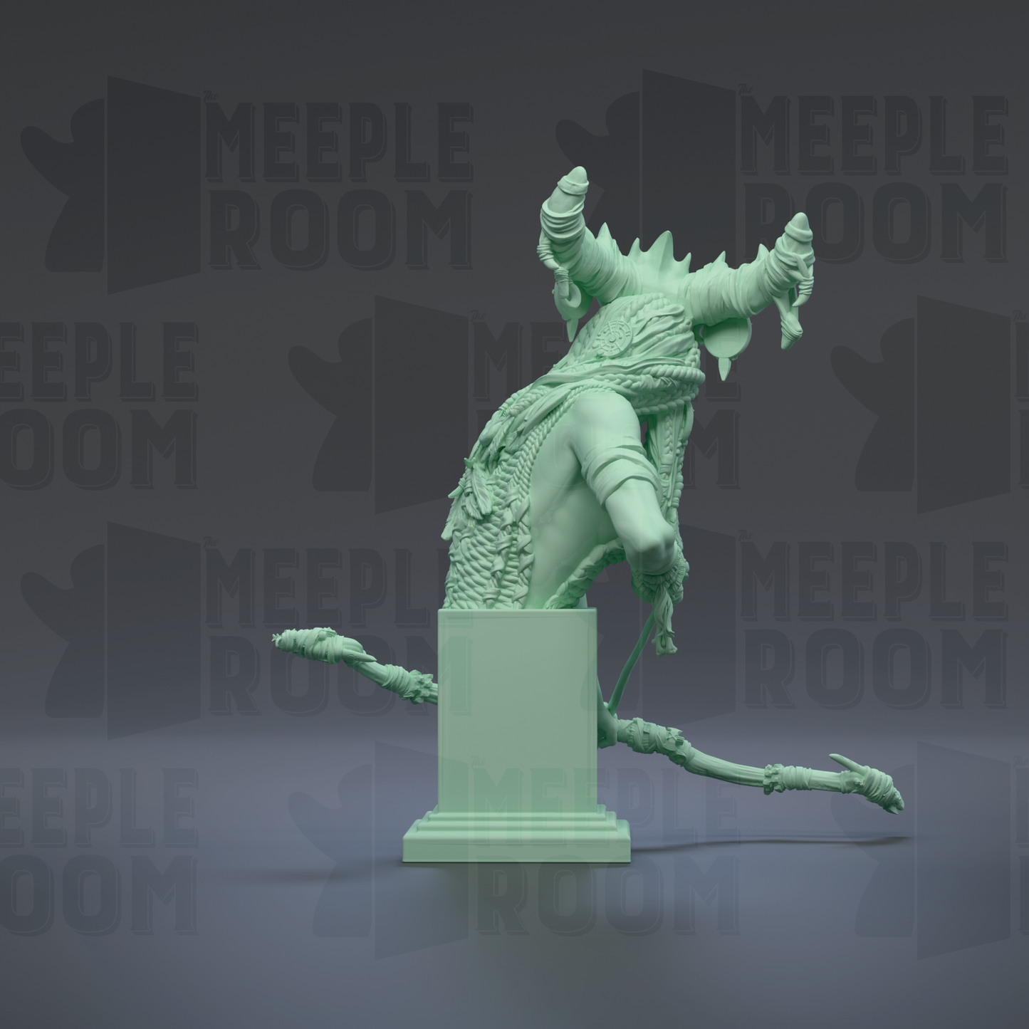 A green statue of a mythical creature with horns and a flowing robe, standing on a pedestal.