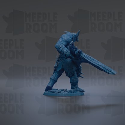 A blue figurine of a warrior-like character holding a large sword, standing on a base.