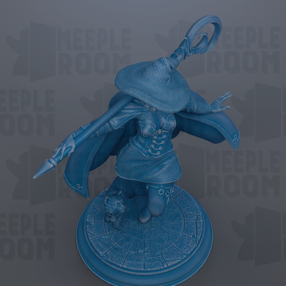 A blue statue of a woman with a pointed hat and a staff, standing on a circular base.