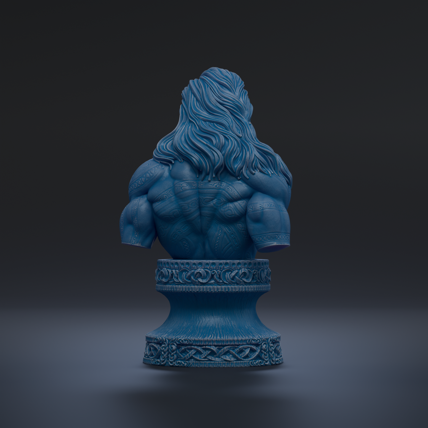 A blue bust sculpture of a muscular man with long hair, displayed on a decorative pedestal against a dark background.