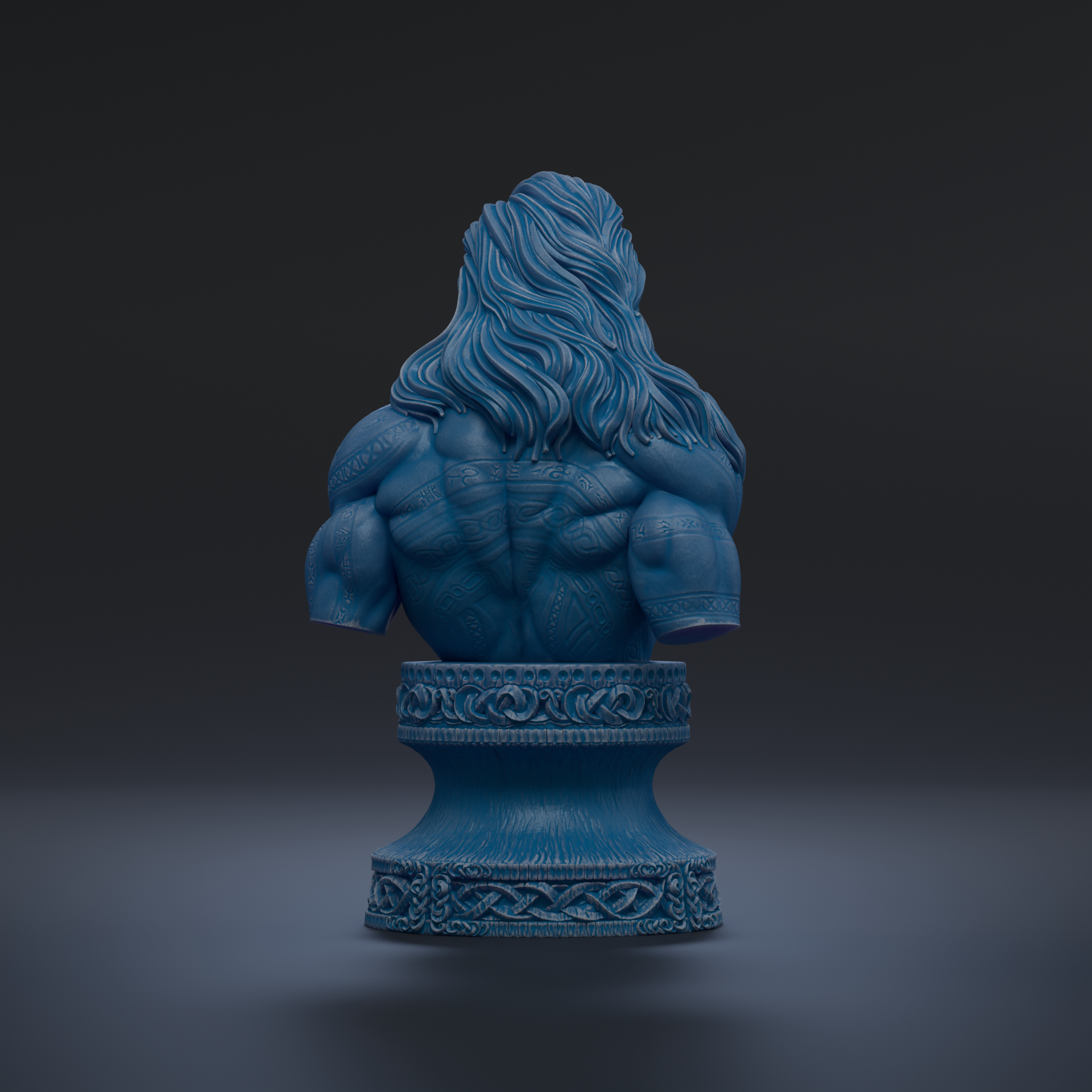 A blue bust sculpture of a muscular man with long hair, displayed on a decorative pedestal against a dark background.