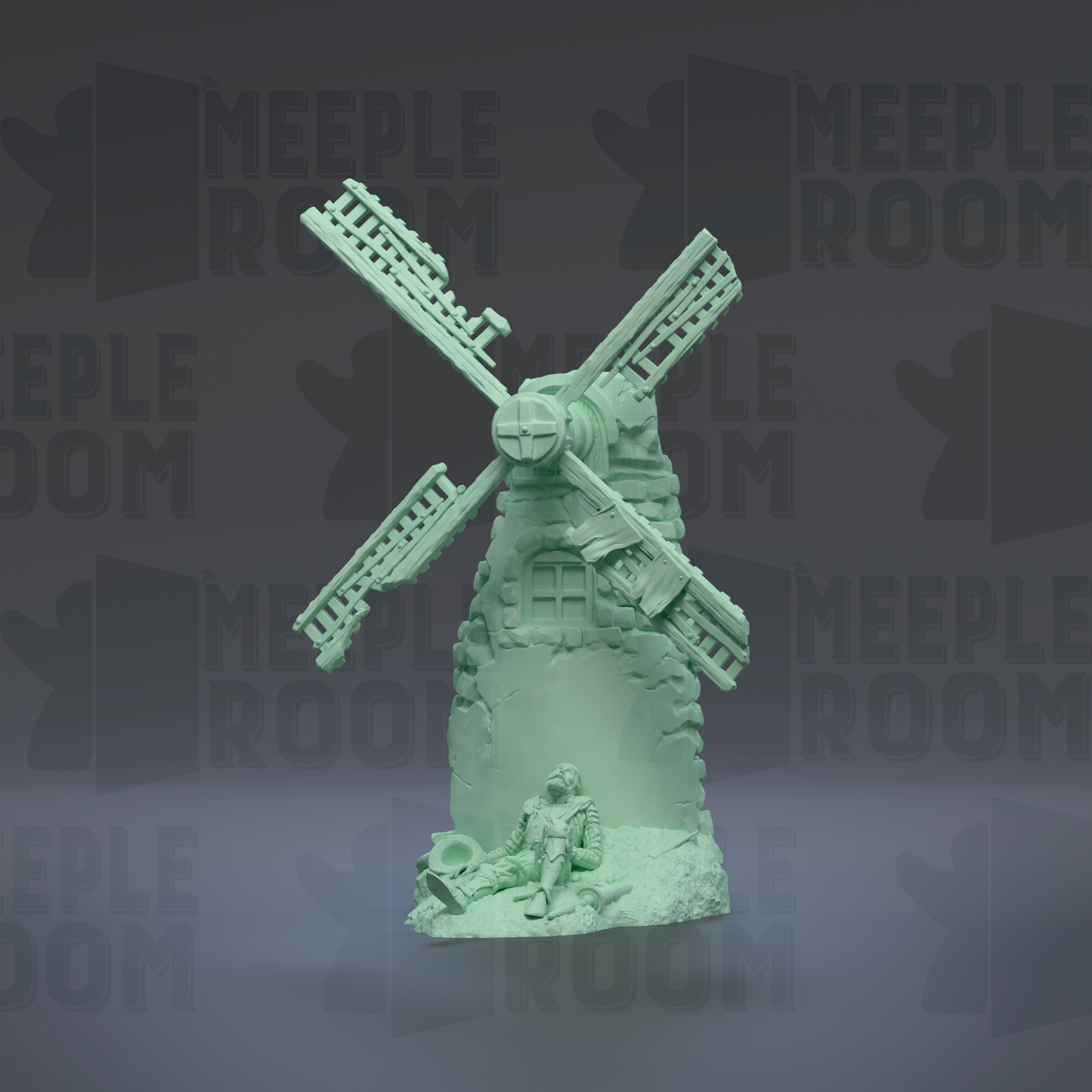 A green figurine of a windmill with a person sitting on a rock in front of it.