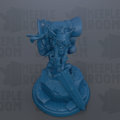 A blue figurine of a character with a large head and a sword, standing on a rock.