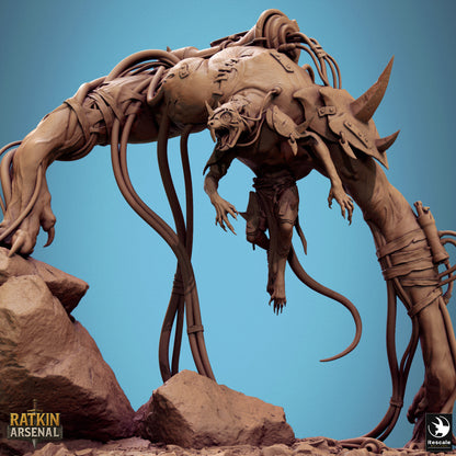 a large, intricate, and imposing robotic creature with a long, flexible body and sharp teeth, standing on a rocky surface.