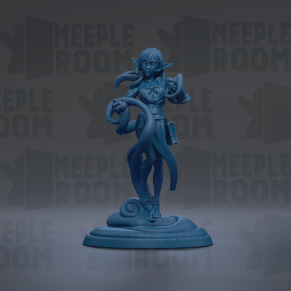 A blue figurine of a female character with long hair and a flowing skirt, standing on a pedestal and holding a scroll.