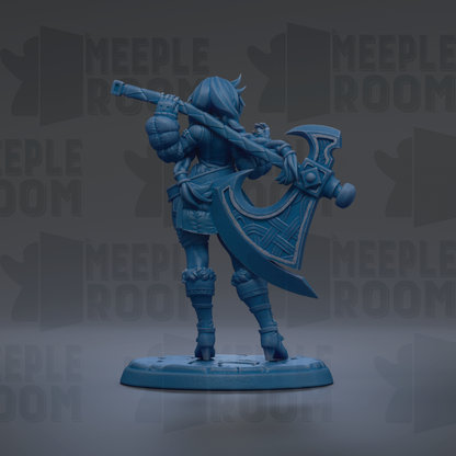 A blue figurine of a female character holding a large weapon, standing on a base.