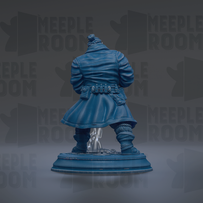 A blue statue of a person standing on a pedestal against a dark background.