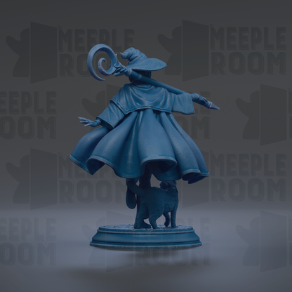 A blue statue of a wizard with a staff, standing on a pedestal and holding a staff in one hand and a staff in the other.