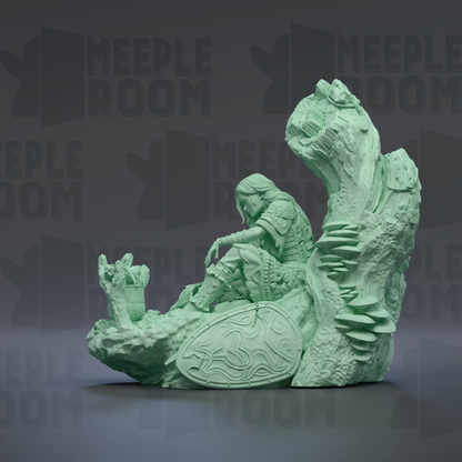 A green, 3D-rendered statue depicting a figure sitting on a rock formation, with a shield-like object in front of them.