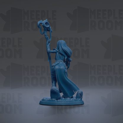 A blue figurine of a woman holding a staff and standing on a rock formation against a dark background with repeated text.