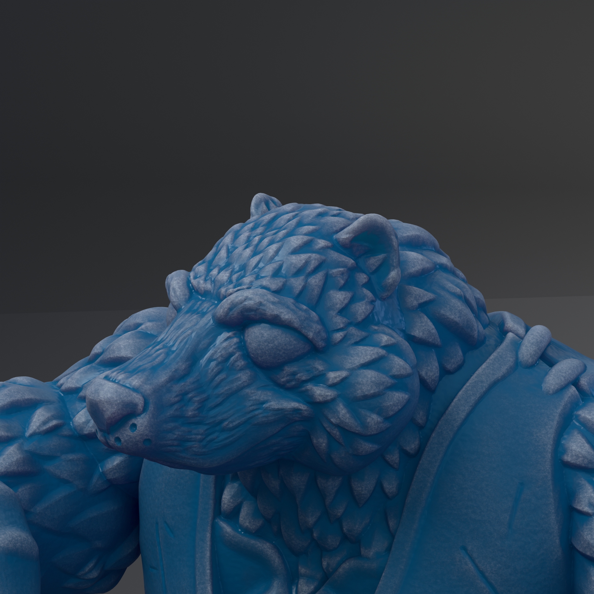 A close-up view of a blue, sculpted bear head with intricate details and textures.