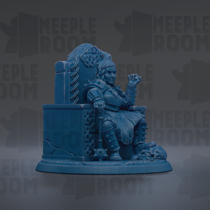 A blue figurine of a person sitting on a throne, with a skull and crossbones on the throne and a skull on the ground.