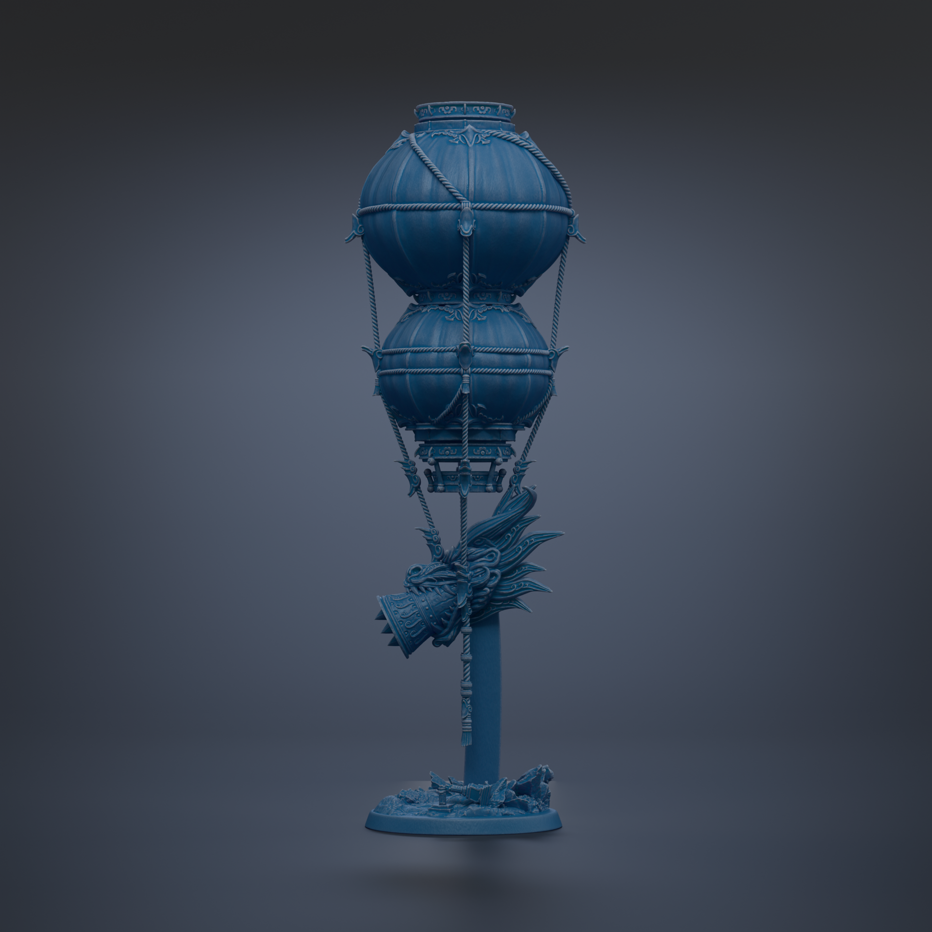 A blue, spherical sculpture with a dragon head and other decorative elements, standing on a base.