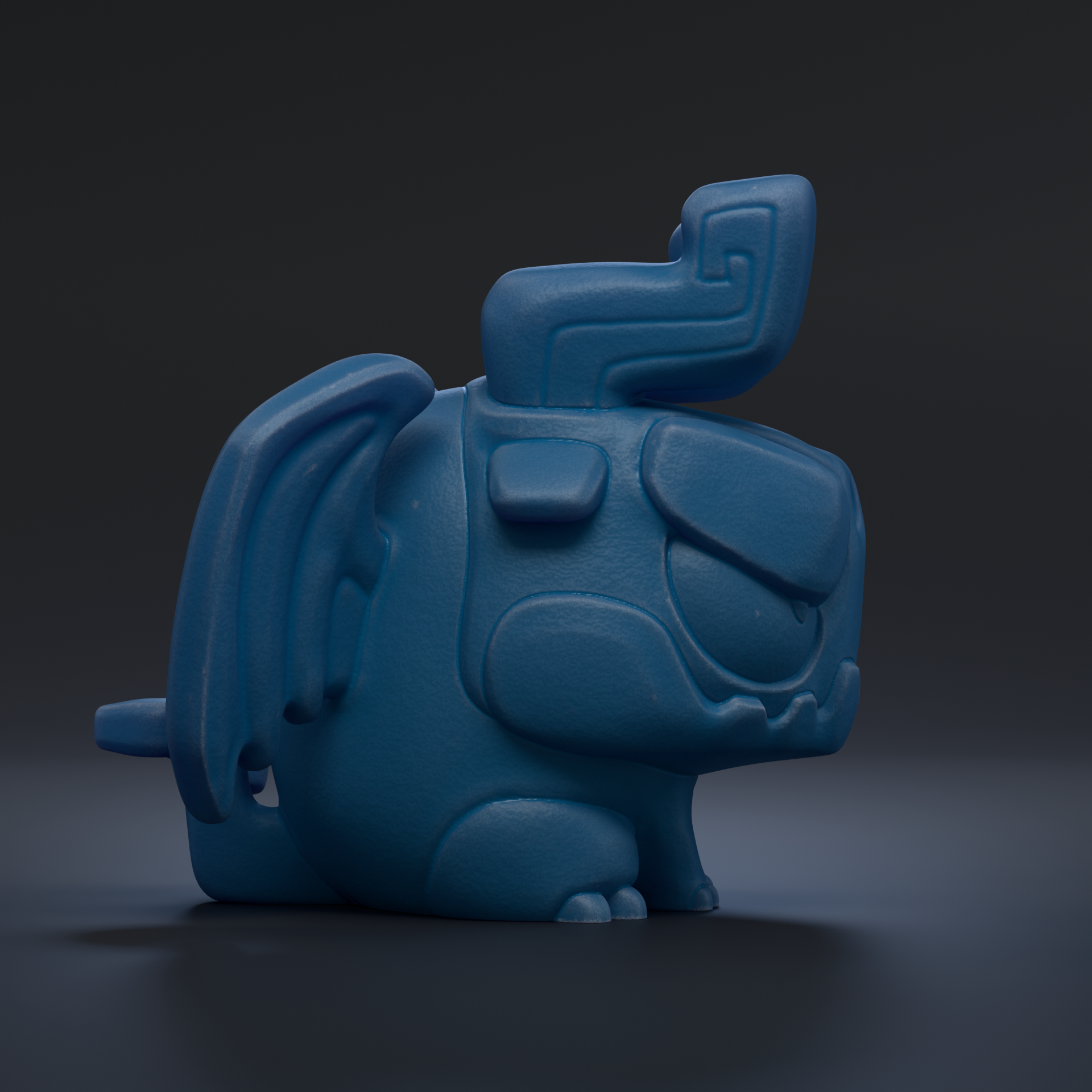 A blue, winged, cartoon-like creature with a pointed nose and a large, curved horn on its head, sitting on a dark surface.