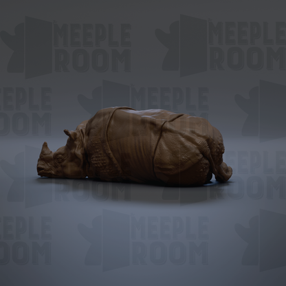 A 3D rendering of a rhinoceros lying down on a gray background.