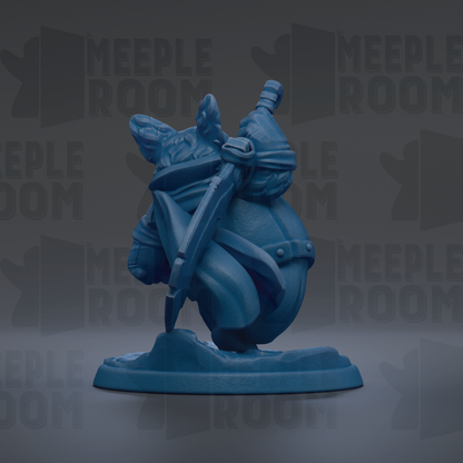 A blue figurine of a character holding a sword and shield, standing on a base.
