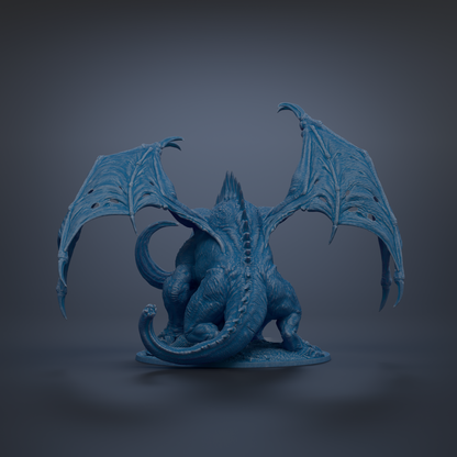 A blue dragon figurine with outstretched wings and sharp teeth is depicted against a dark background.