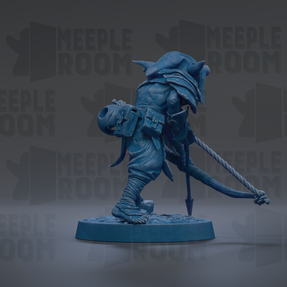 A blue figurine of a warrior-like character with a pointed hat and a sword, standing on a platform.