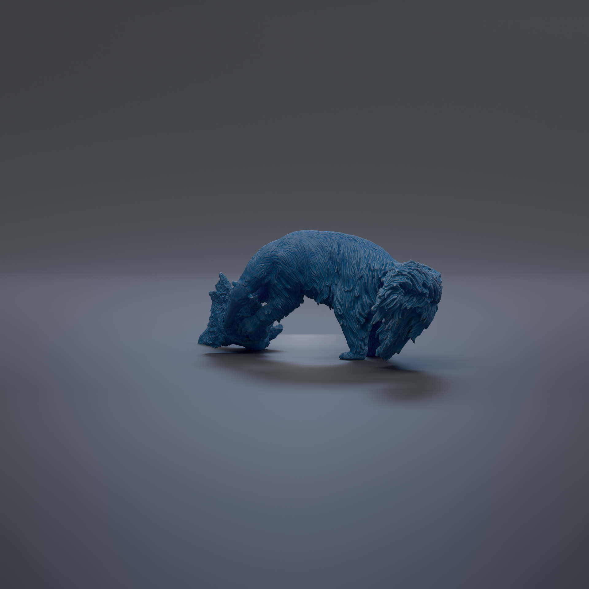 A blue, furry animal is shown in a crouched position on a gray surface.