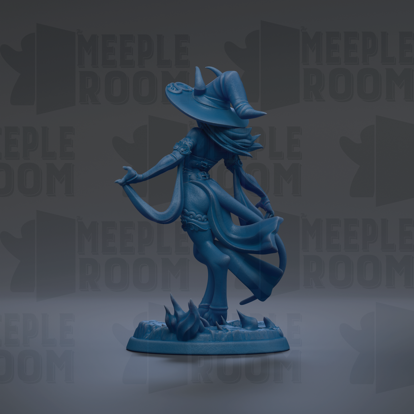 A blue figurine of a witch with a flowing dress and a large hat, standing on a base with a dark background.