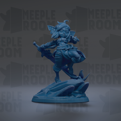 A blue figurine of a character with a sword and shield, standing on a rock formation.