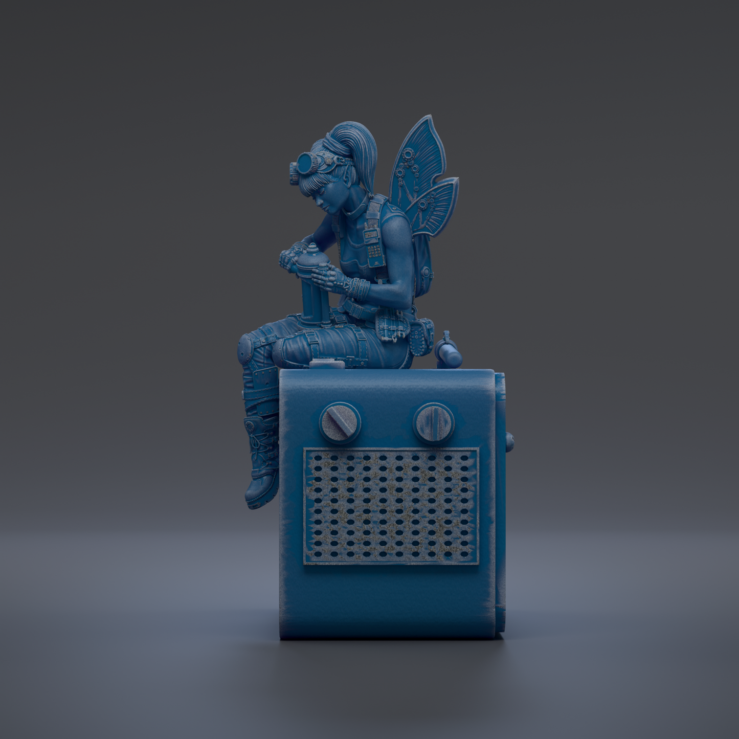 A blue fairy figurine sitting on top of a blue radio.