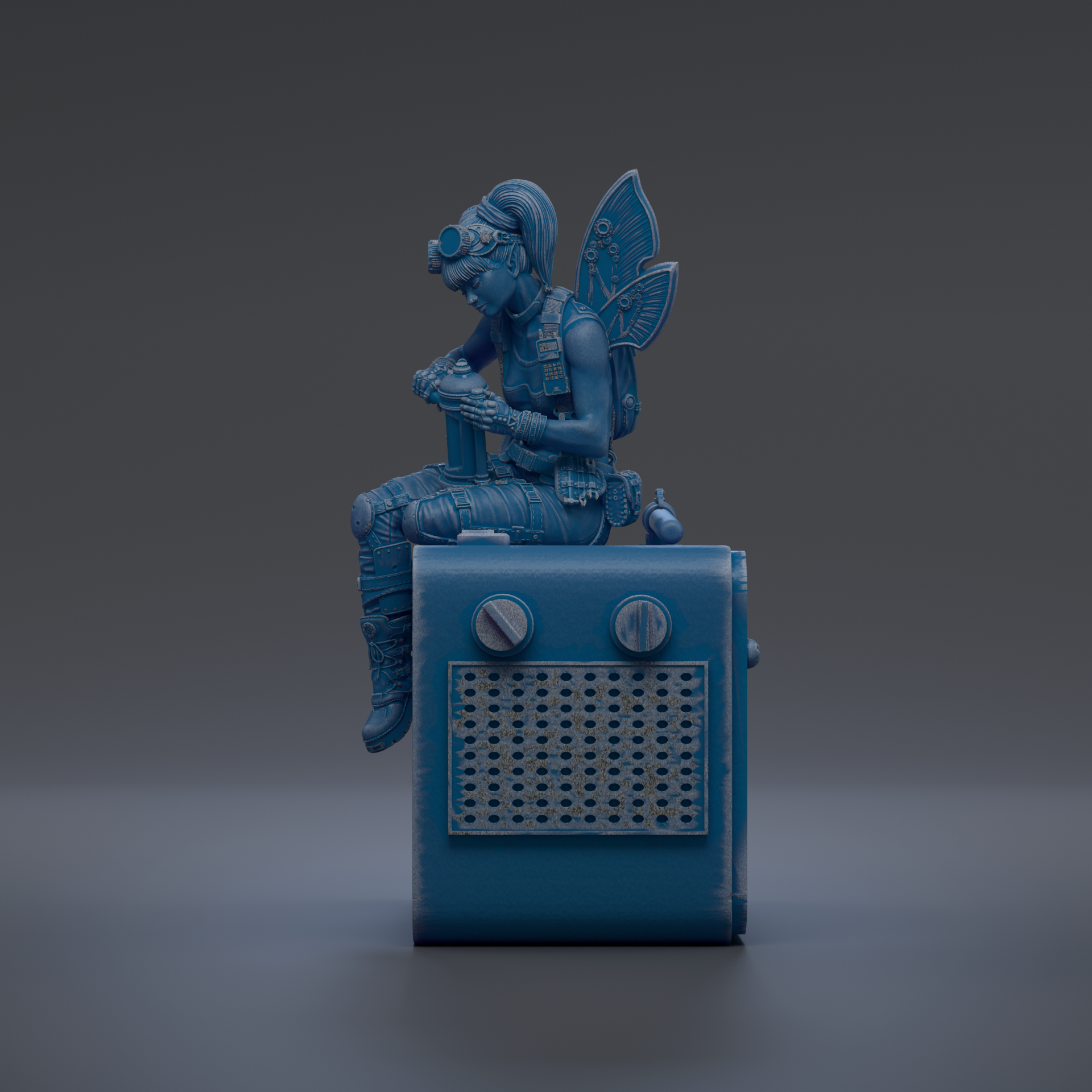 A blue fairy figurine sitting on top of a blue radio.