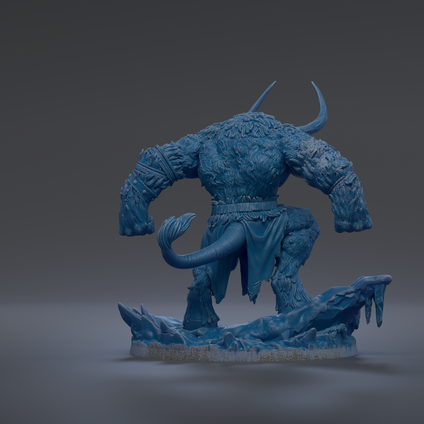A blue, furry monster figurine with horns and a tail, standing on a rocky base.