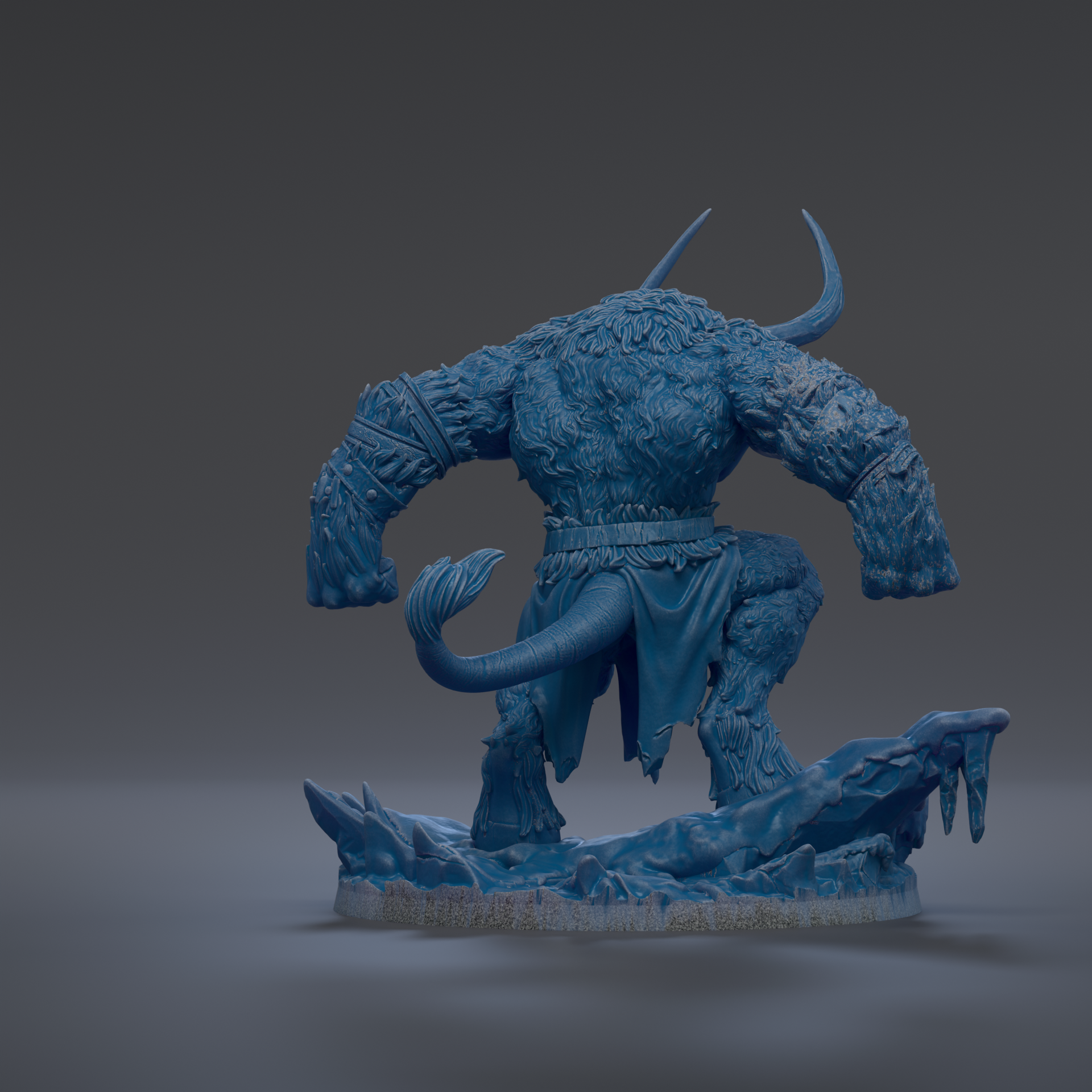 A blue, furry monster figurine with horns and a tail, standing on a rocky base.