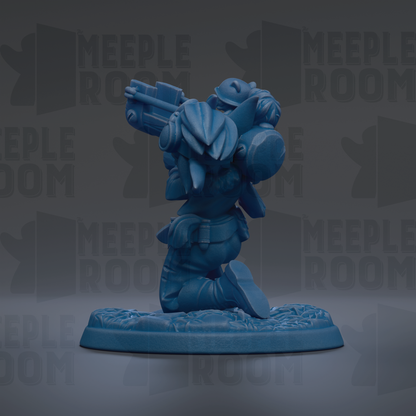 A blue figurine of a character with a gun, standing on a base with a floral pattern.